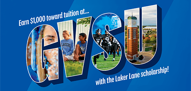 Students posing around a 'GVSU' art installation